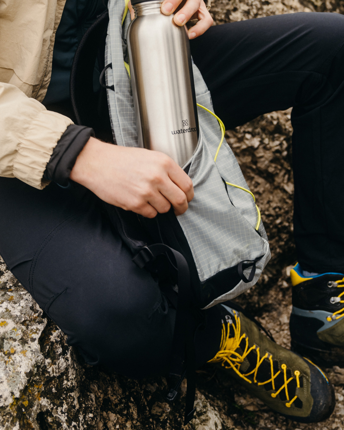 Person holding the All-Purpose Ultralight Bottle with Swing Lid, showcasing its ergonomic design for easy, hygienic drinking on-the-go.