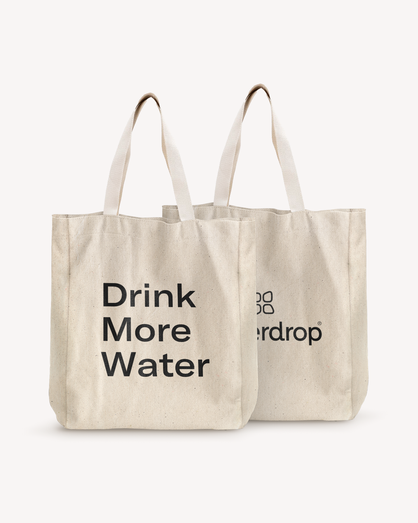 Two white shopping bags with black text, made of high-quality cotton, designed to hold personal items and waterdrop® products.