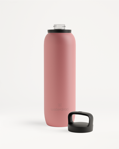 All-Purpose Thermo · Spout Lid, a pink stainless steel water bottle with a black cap, ideal for keeping drinks ice-cold up to 24 hours.