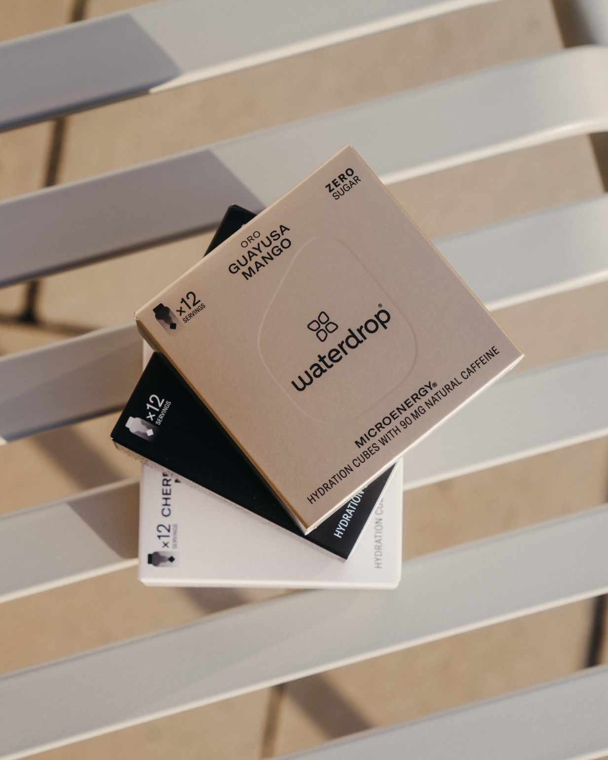 Stacked boxes of Twin Pack Microenergy featuring fruity flavors with natural caffeine. Includes two 12-packs. Limited time offer from waterdrop® EU.