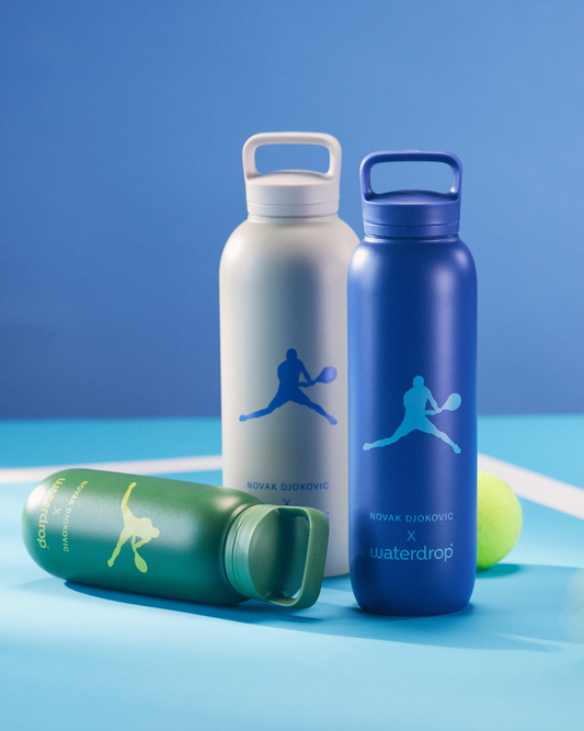Novak Djokovic · All-Purpose Thermo · Spout Lid bottles and a tennis ball, featuring tennis-themed designs and double-walled stainless steel for 24-hour cold hydration.